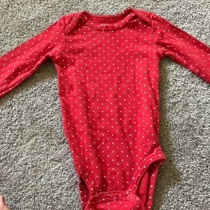 Red and white polka dot onesie